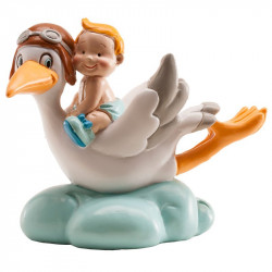 Figur auf der Torte Junge fliegender Kranich auf einer Wolke